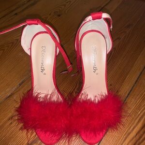 Red feather heels. Worn once.